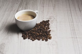 coffee beans near cup 320